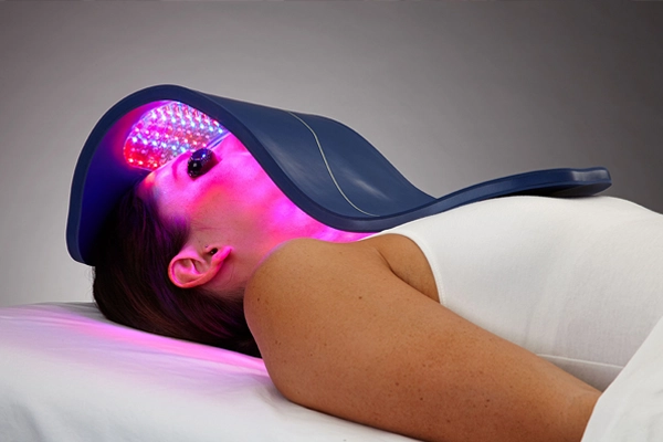 woman receiving celluma light therapy treatment